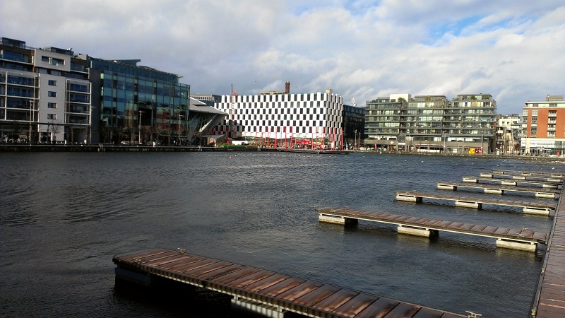 2013-01-28 12.50.03.jpg - View of Grand Canal and Plaza from Ringsend Road, in the Docklands area of Dublin.  The weird shaped building next to the checker square building is Grand Canal Theatre.